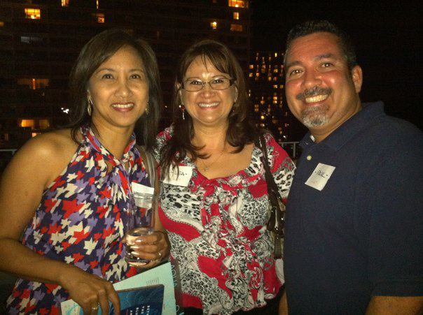 3 Hawaii Aloha Travel agents enjoying themselves at a party