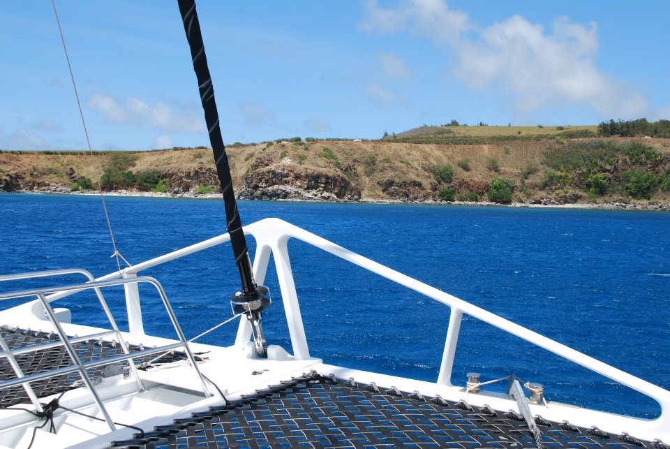 Looking over the bow of a catamaran at Maui