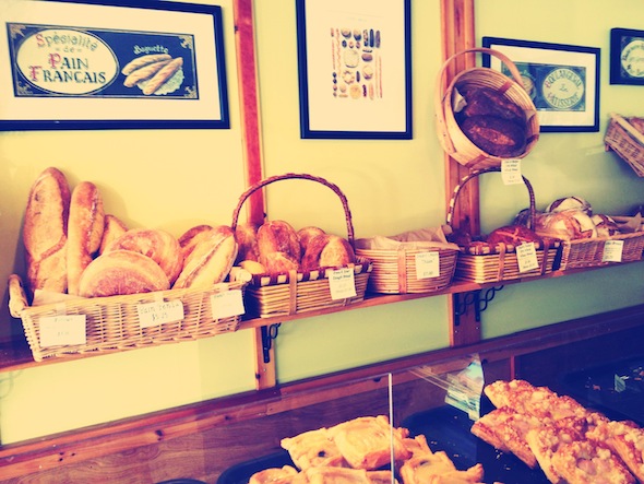 Shelves with baskets of baked goods