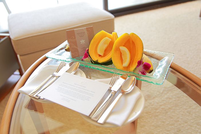 A beautiful plate of fresh fruit and silverware