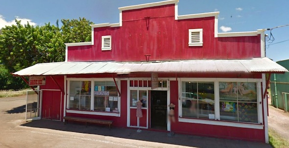 A Red building with an open door in the center