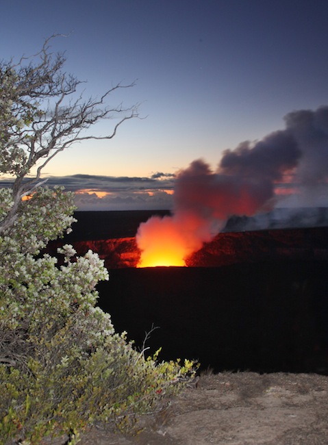 Smoke and light rises from Halemaumau Crater
