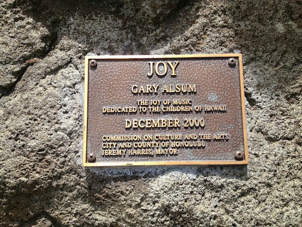 A sign in a rock base