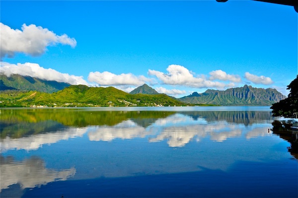 A wide shot of Kaneohe Bay with water like glass