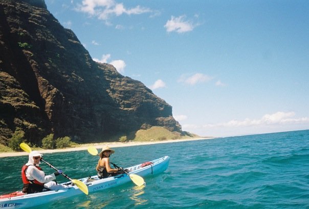 A couple kayaks on Kauai's Na Pali coast