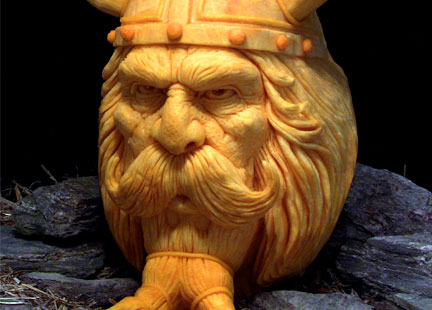 A pumpkin carved into the face of an old man