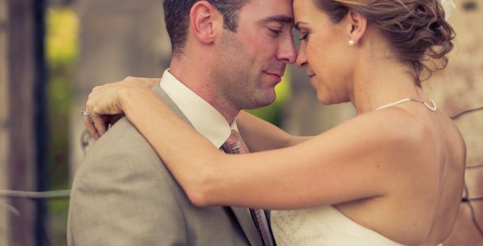 couple embracing during Hawaiian wedding