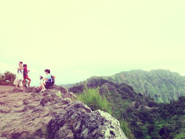 Hikers enjoy the view of Waimanalo from the top of Mariners Ridge on Oahu