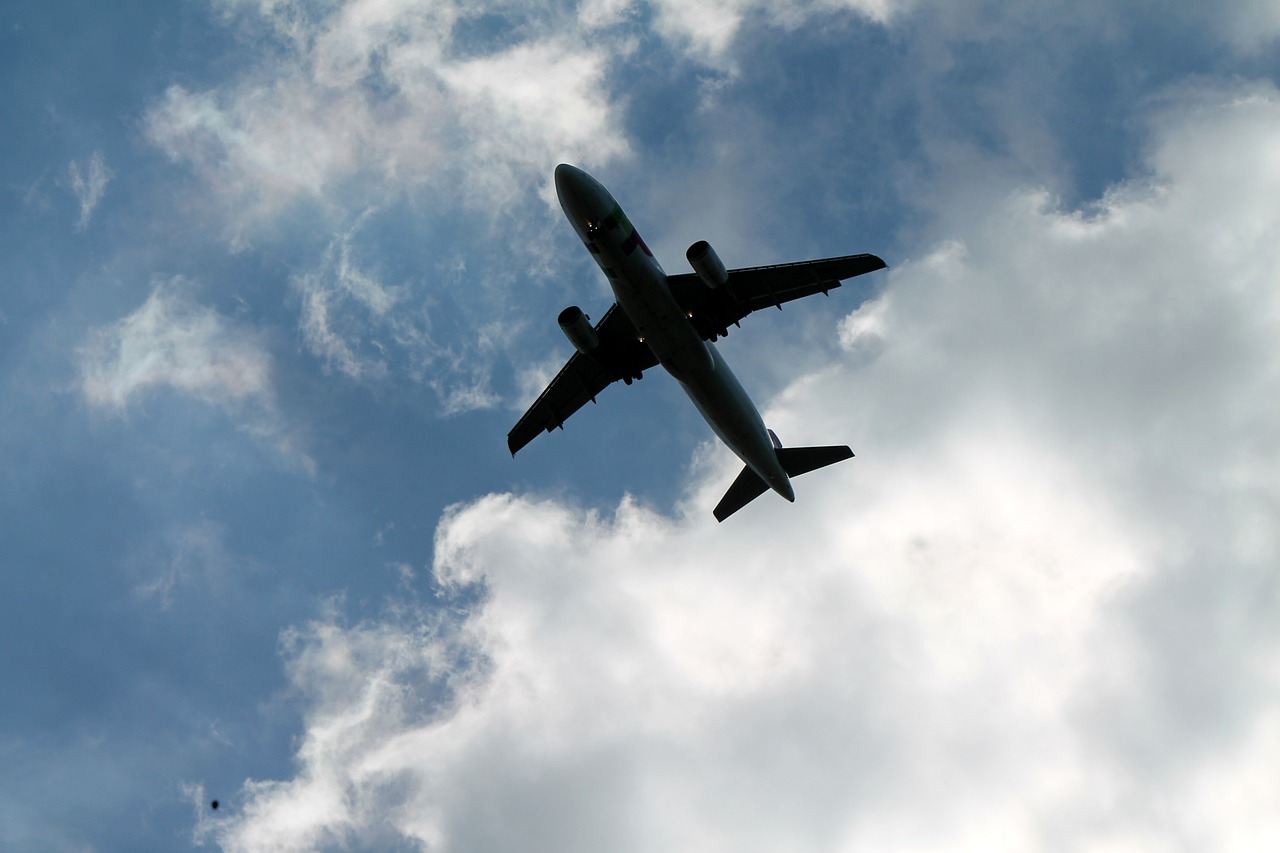 plane flying in the clouds