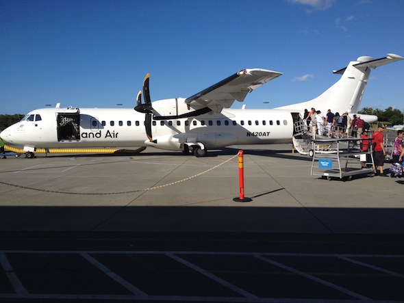Passengers board an Island Air aircraft