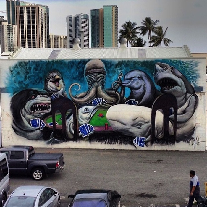 A mural in Kakaako of sharks, octopuses and dolphins playing cards