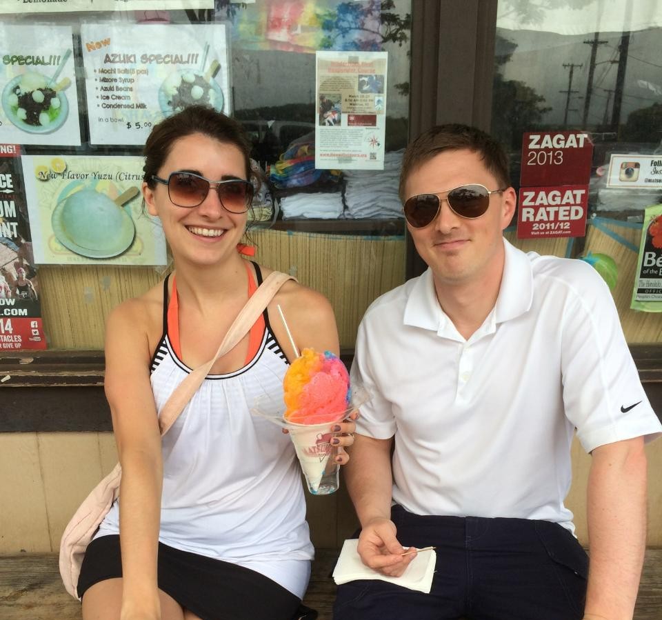 A woman and man with a colorful shave ice