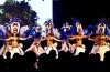 A group of tahitian dancers, dancing on stage