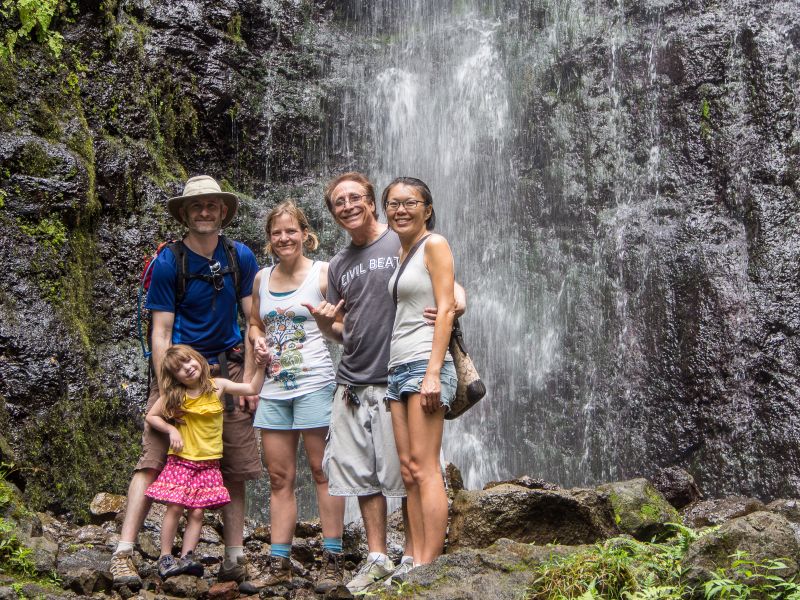 Family wiht Hamama falls in the bacround