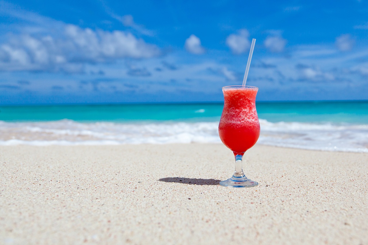 A frozen drink sits on the beach