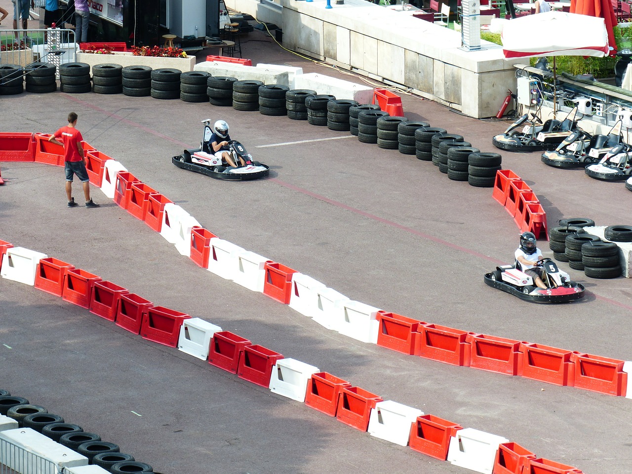 2 Go Karts race on a track