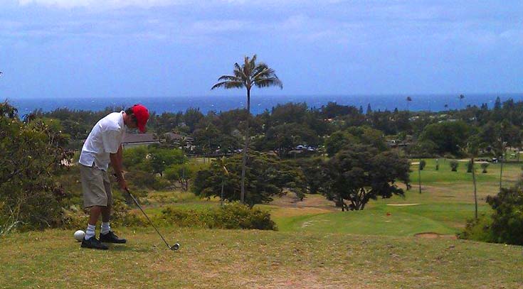 A man tees off at Hawaii Kai Golf Course