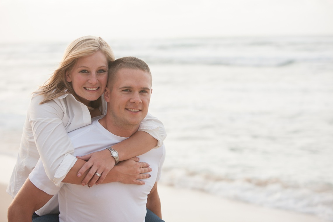 A couple posing on beach