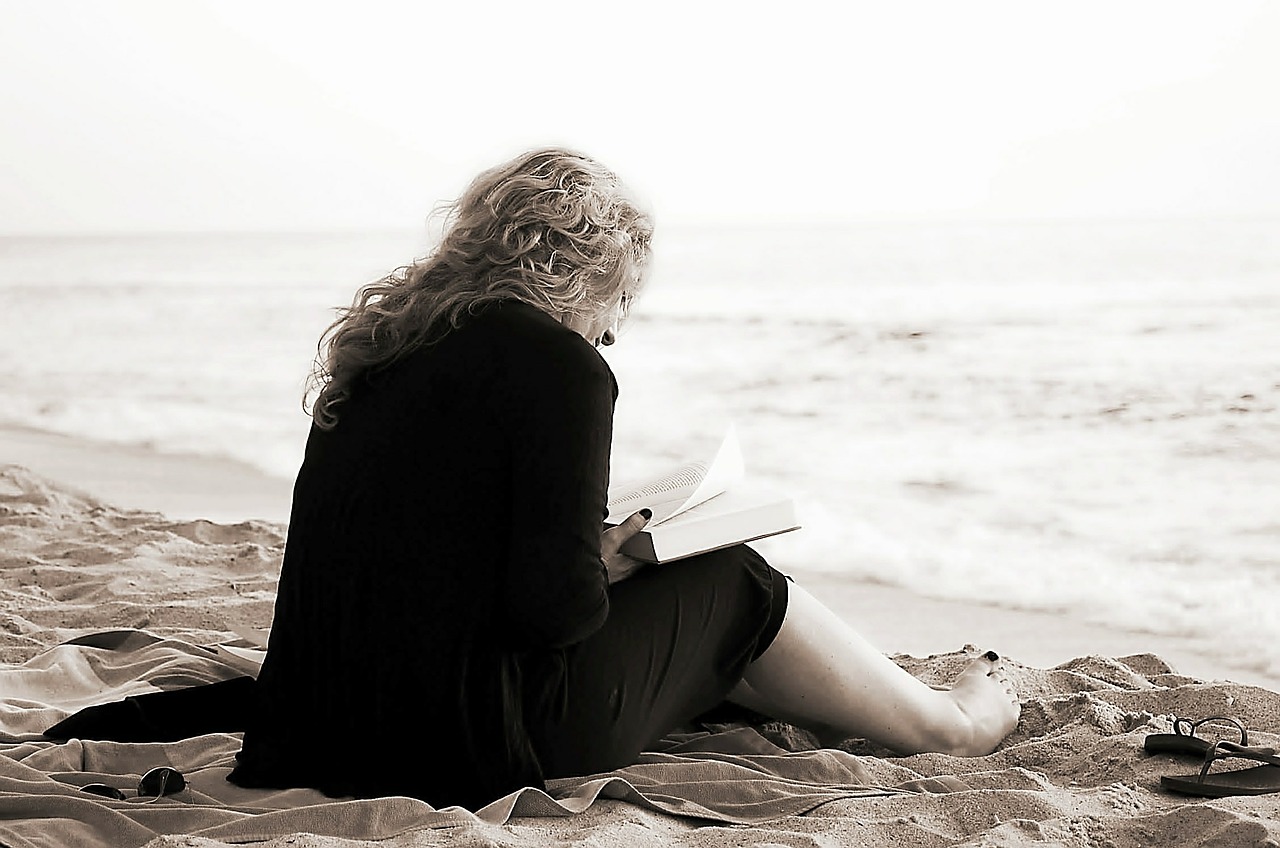 A woan reading on the beach