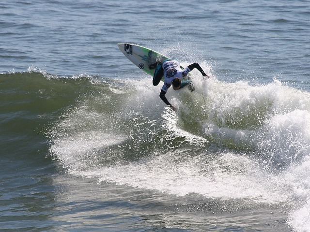 A surfer rides a wave