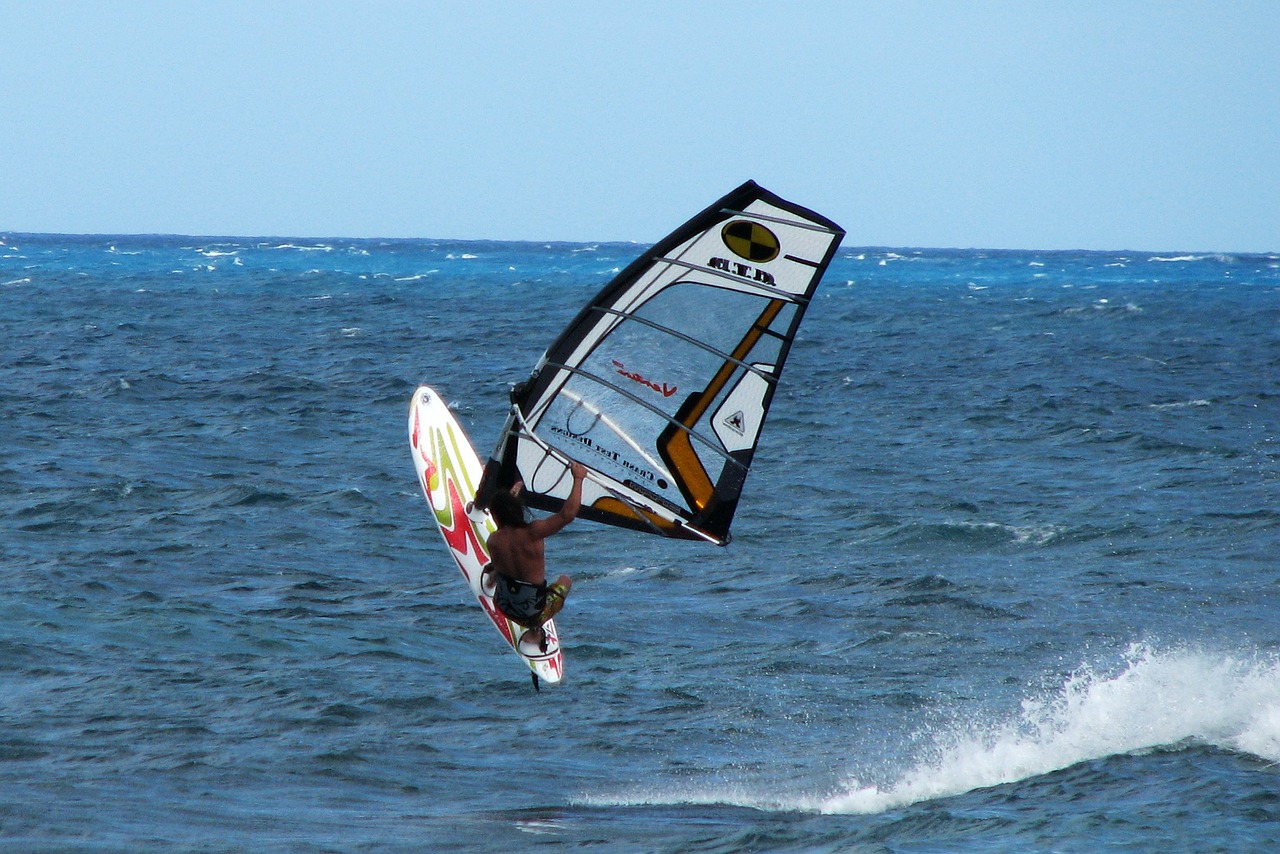 A windsurfer getting air