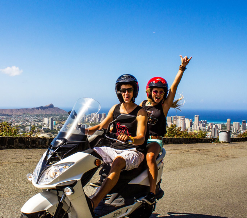 Two people on a scooter