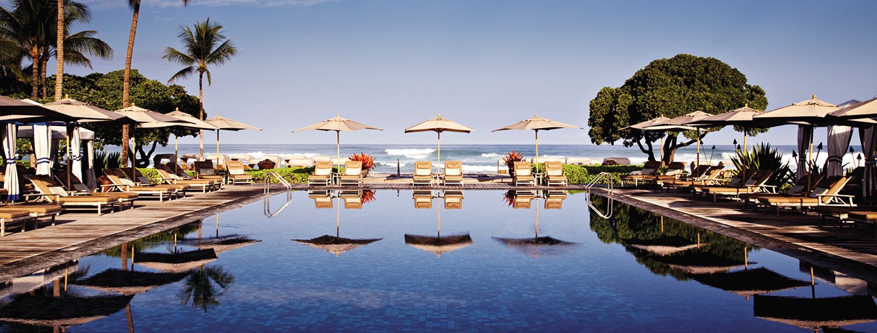 the view from the pool to the ocean at haualalai on the big island