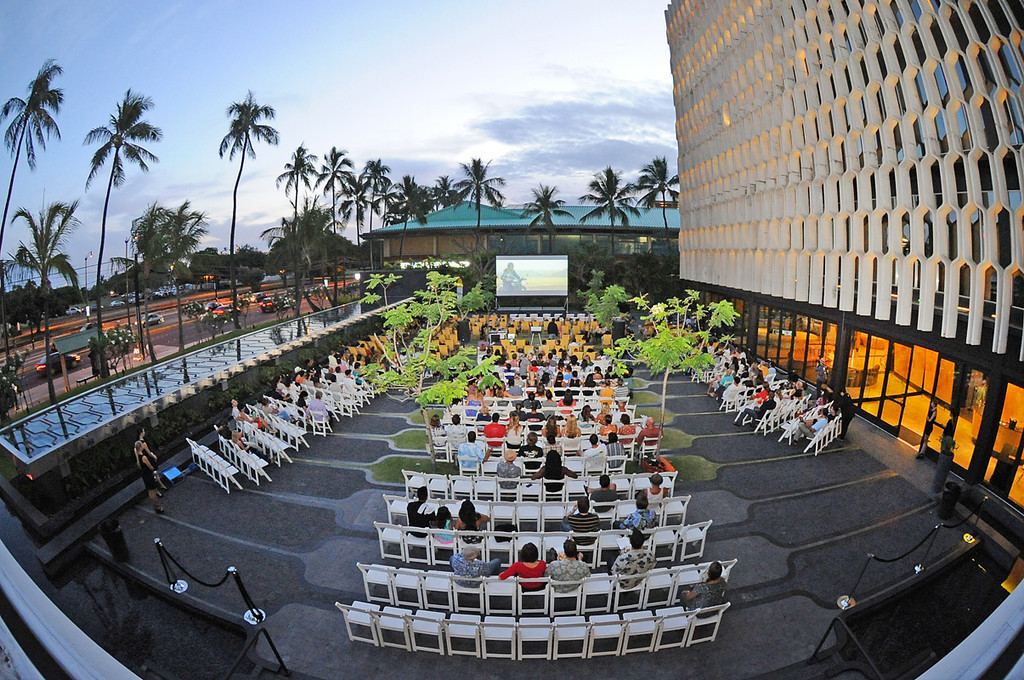 people sitting and watching a movie