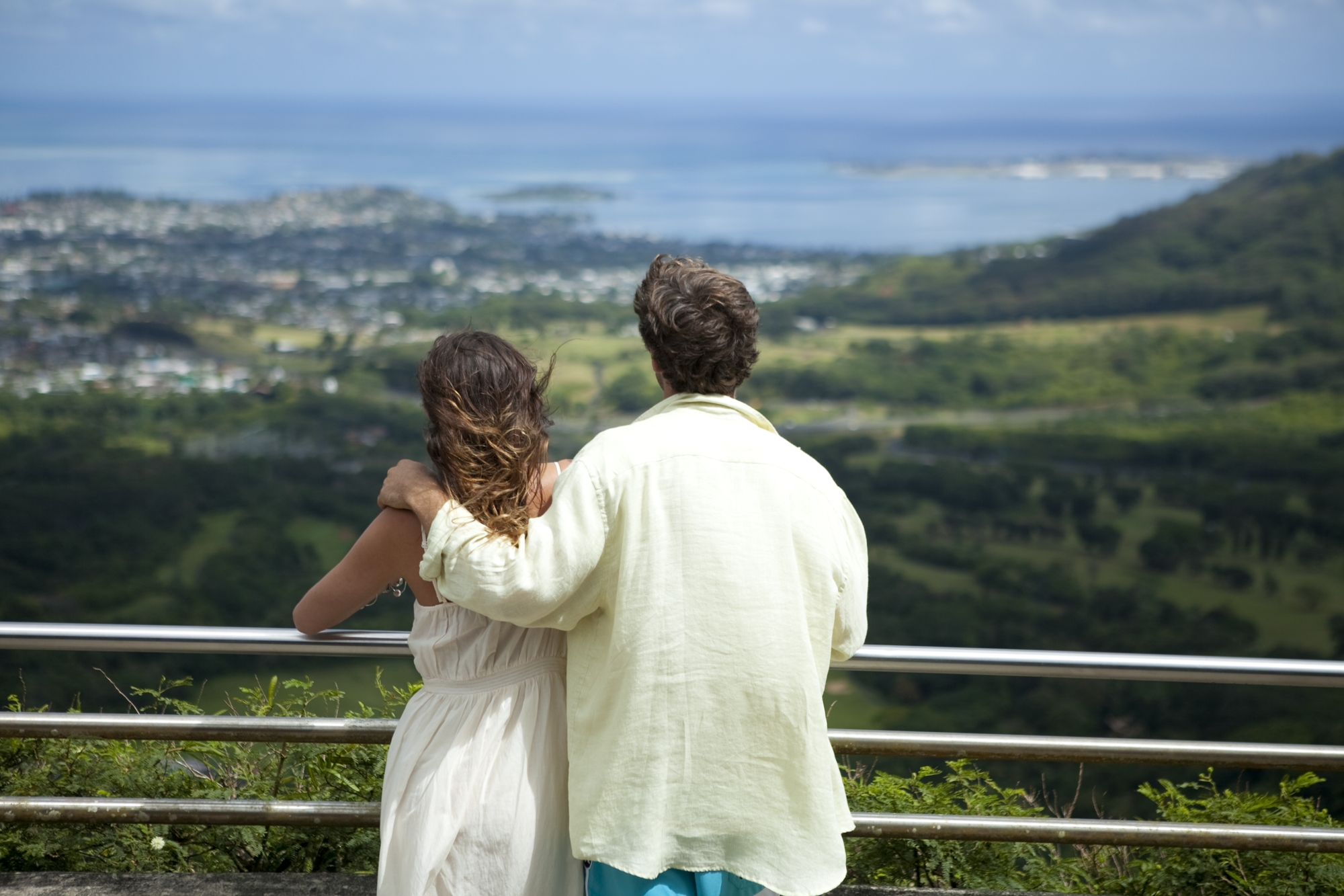 a couple looking out at the Pali Lookout