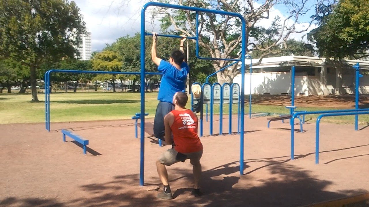 two men exercising with bars