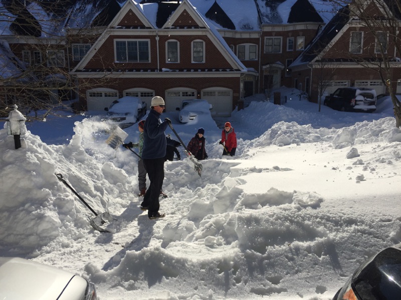 people shoveling snow