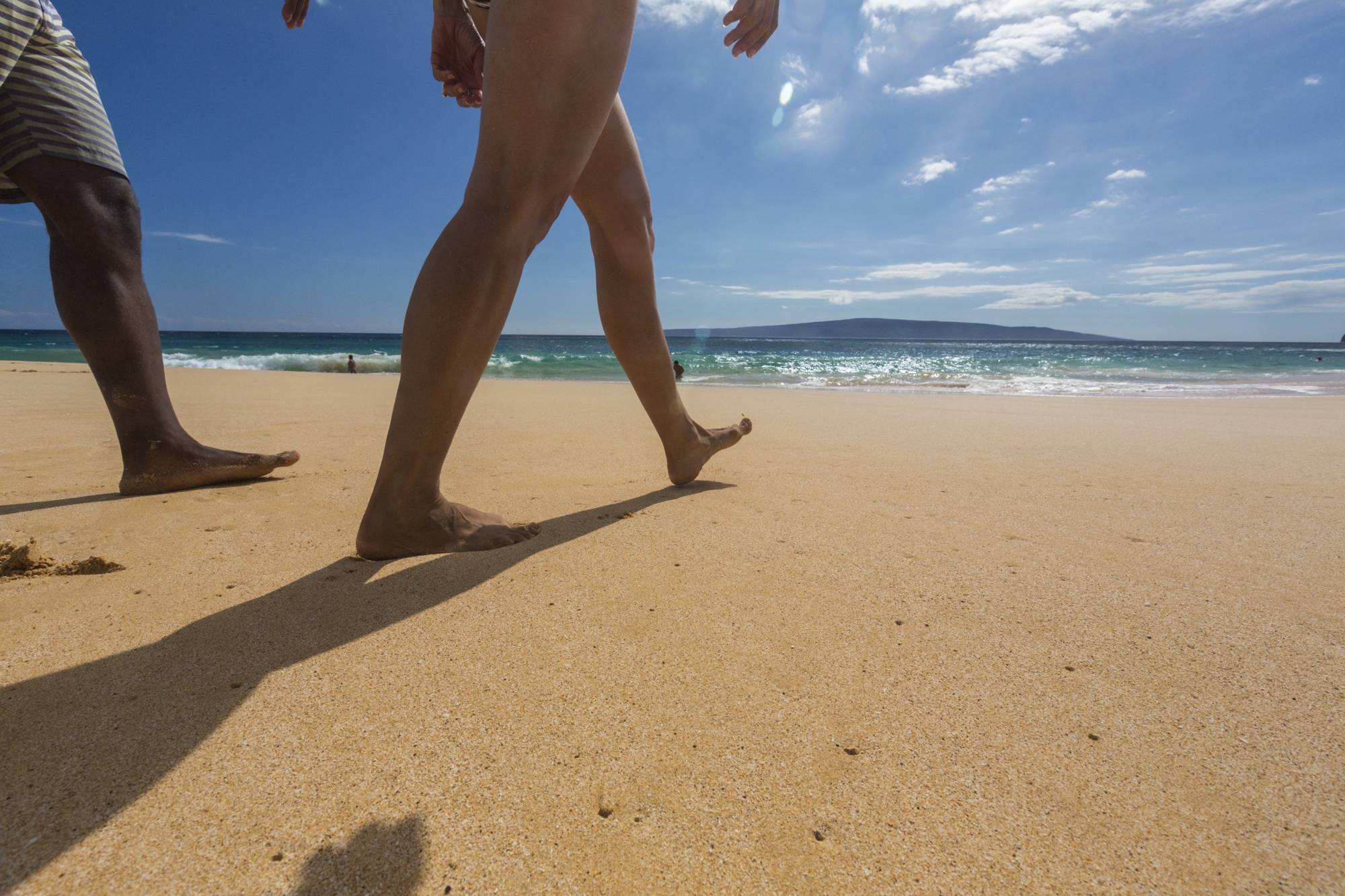 people walking on a beach