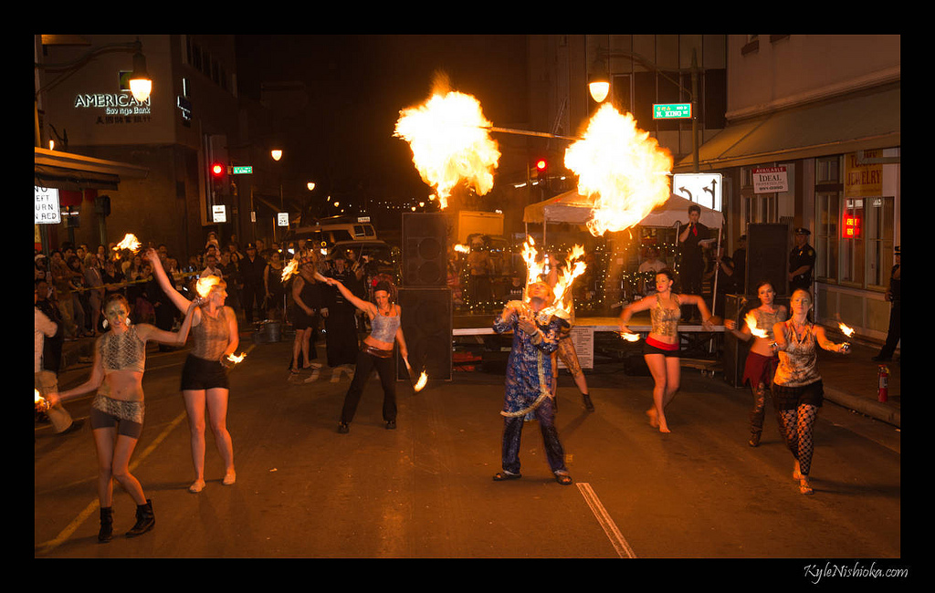 dancers with fire on a street