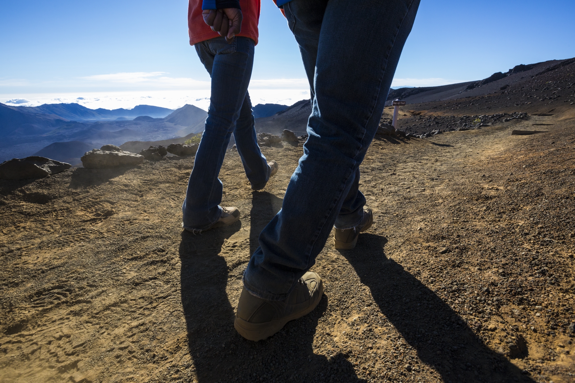 two people hiking, shot of bottom half of their bodies