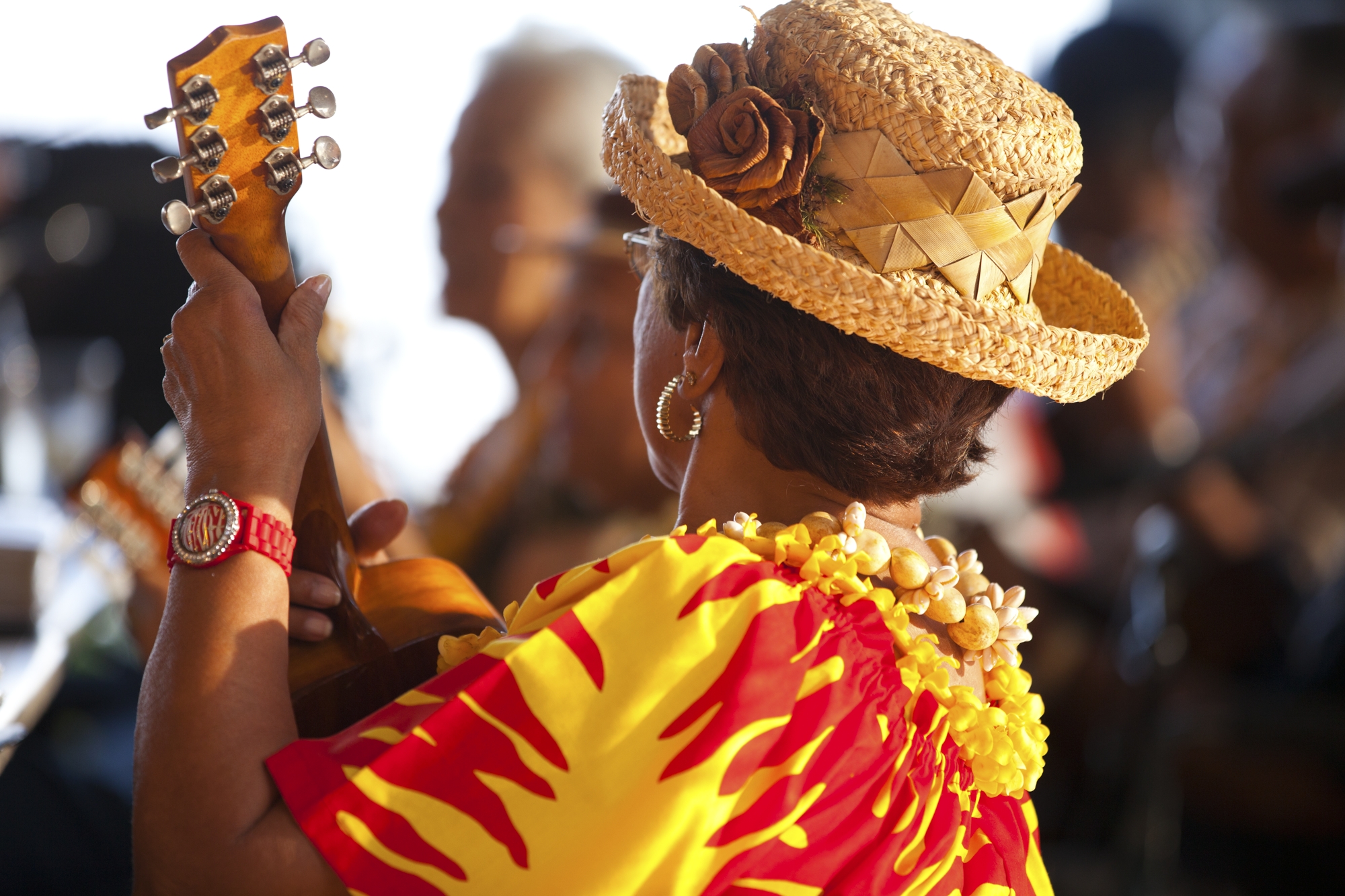 a woman playing the ukulele