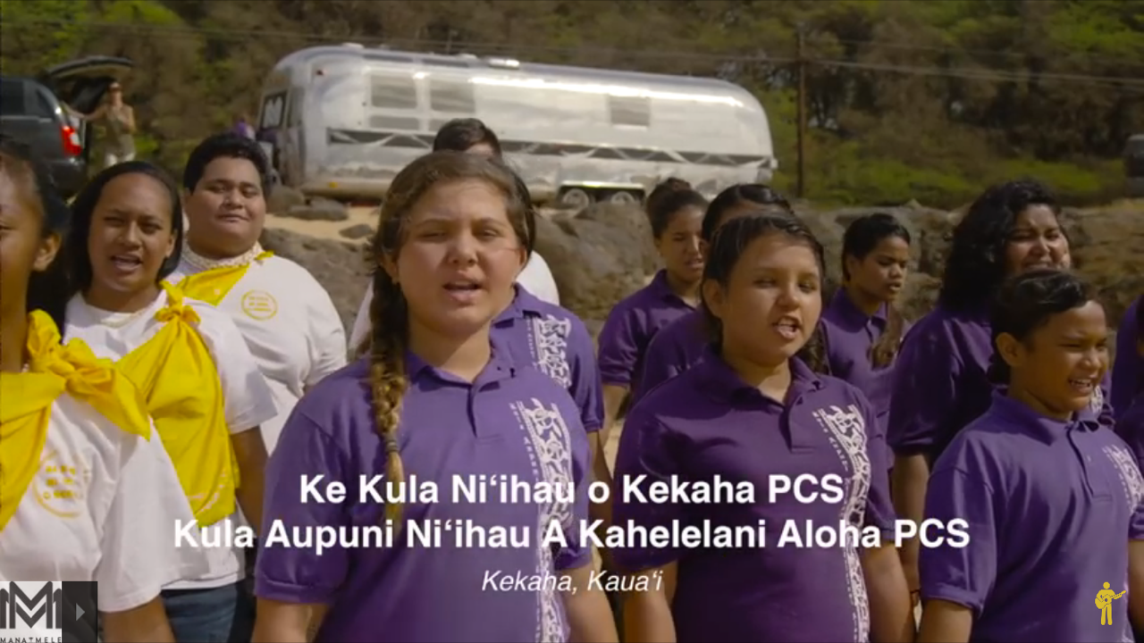 children singing with purple shirts on