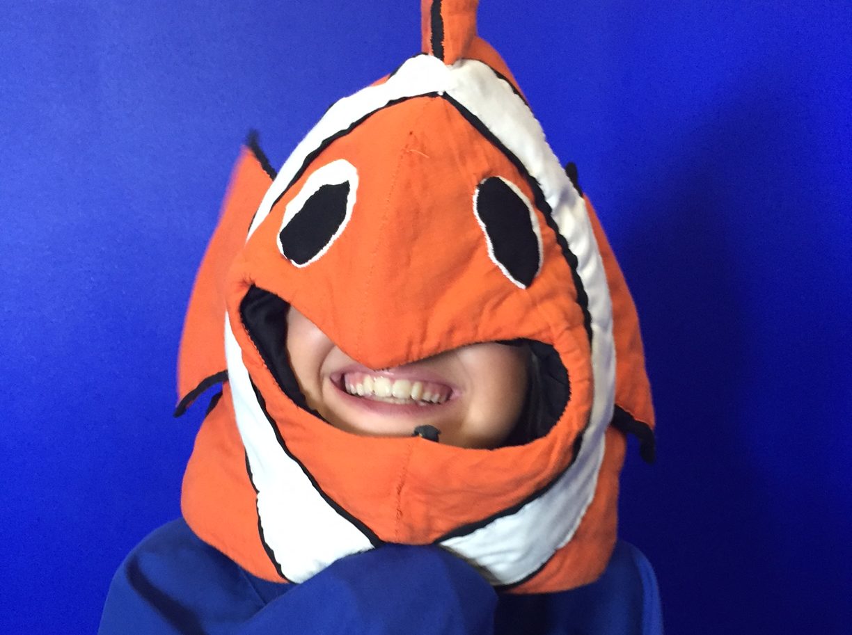 a girl in a fish costume