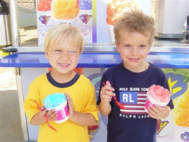 two children eating shave ice