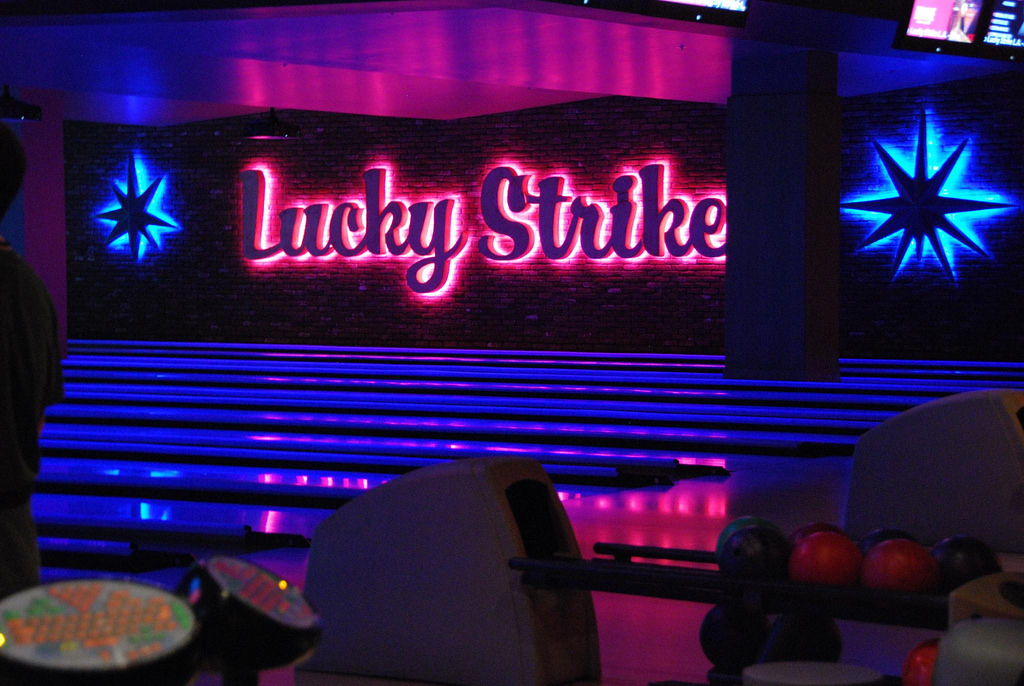 bowling alley lanes lit up with lights