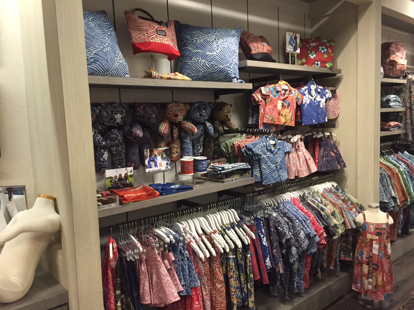 a rack of aloha wear clothes