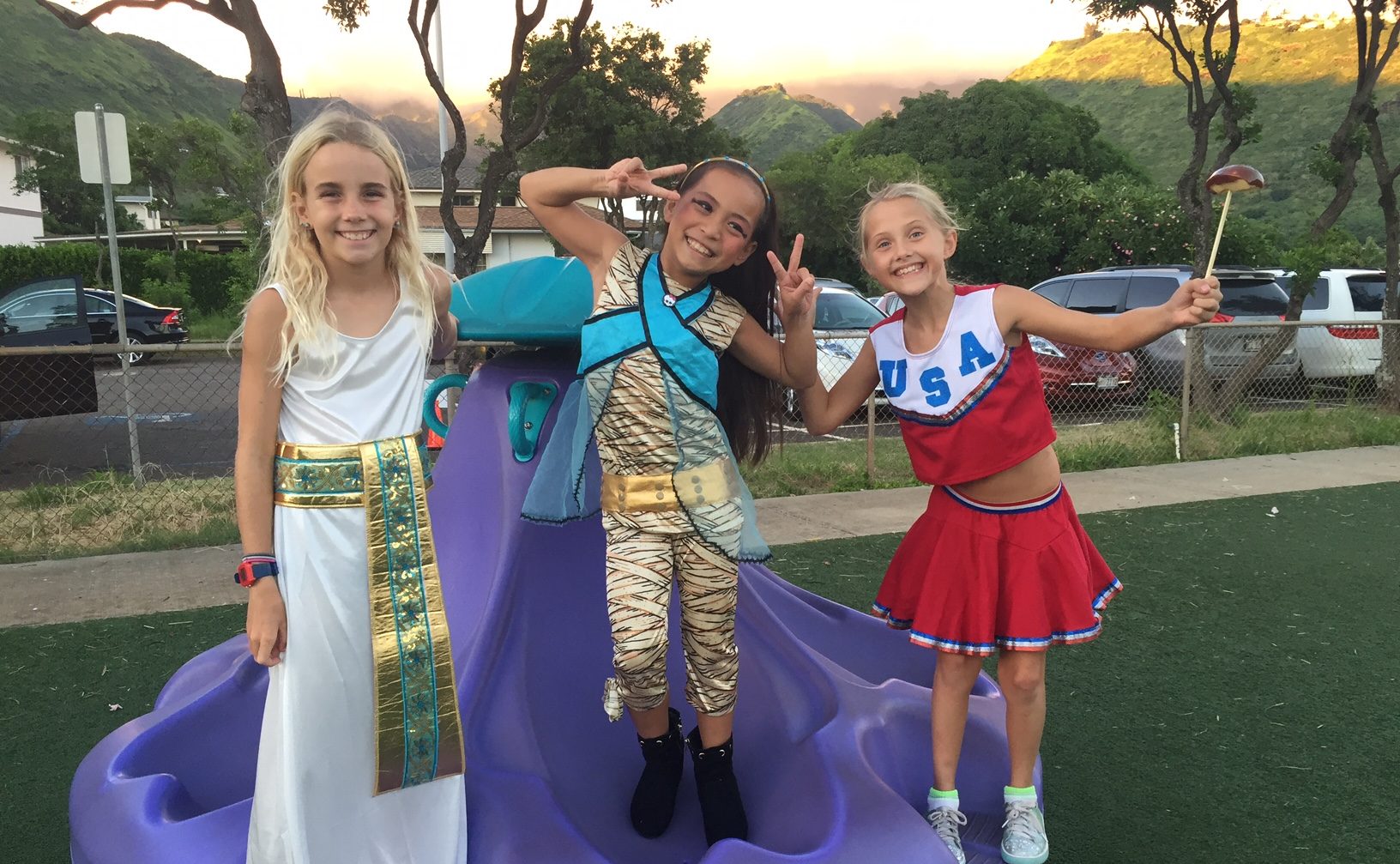 three girls dressed in halloween costumes