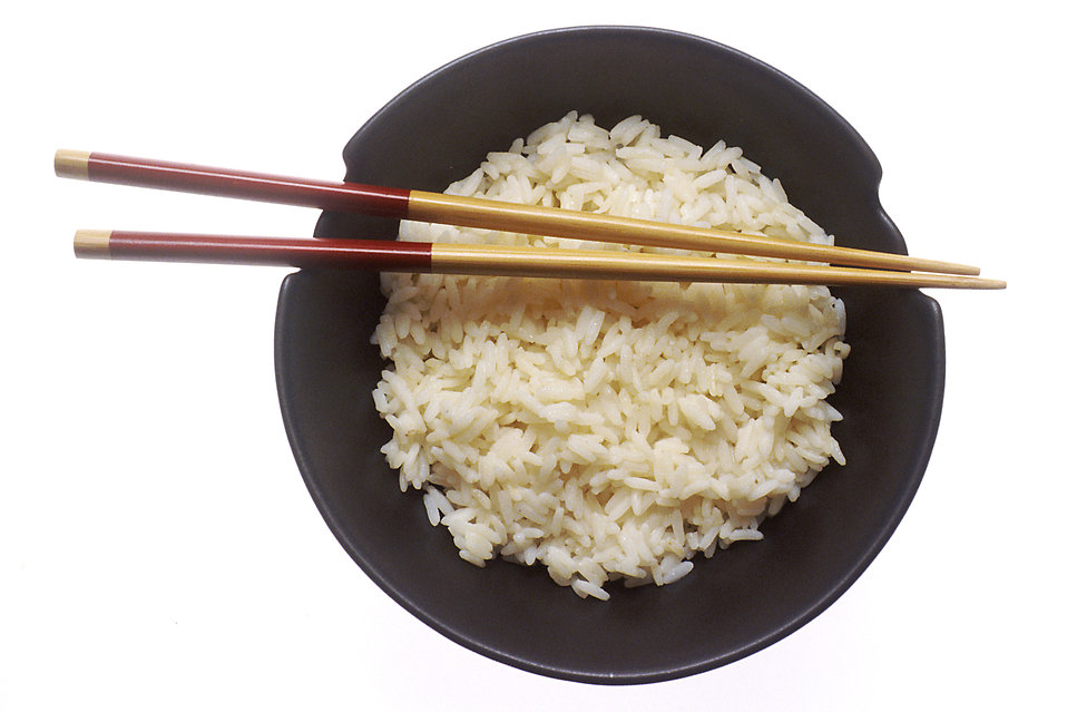 chopsticks resting on a bowl of rice