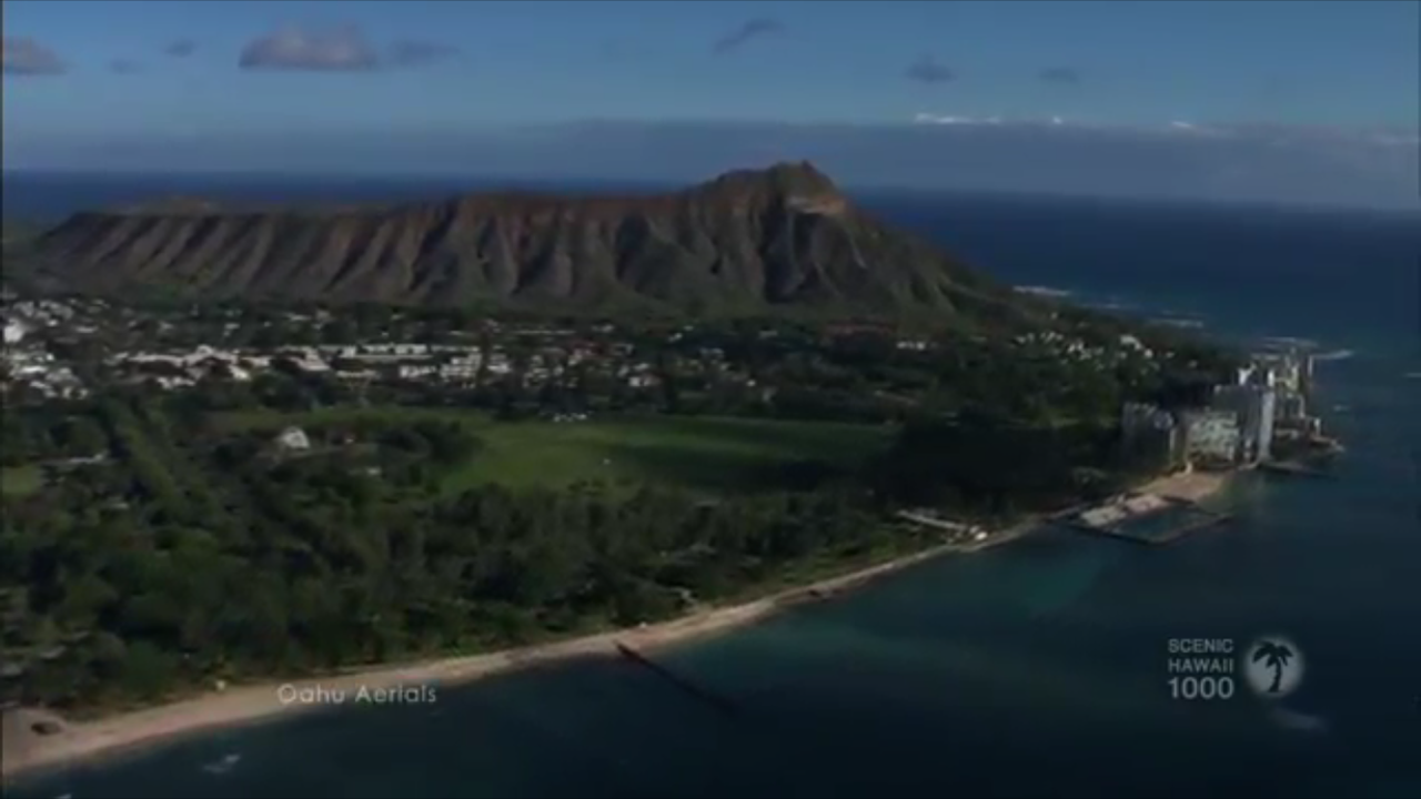 a screenshot of a travel video featuring diamond head