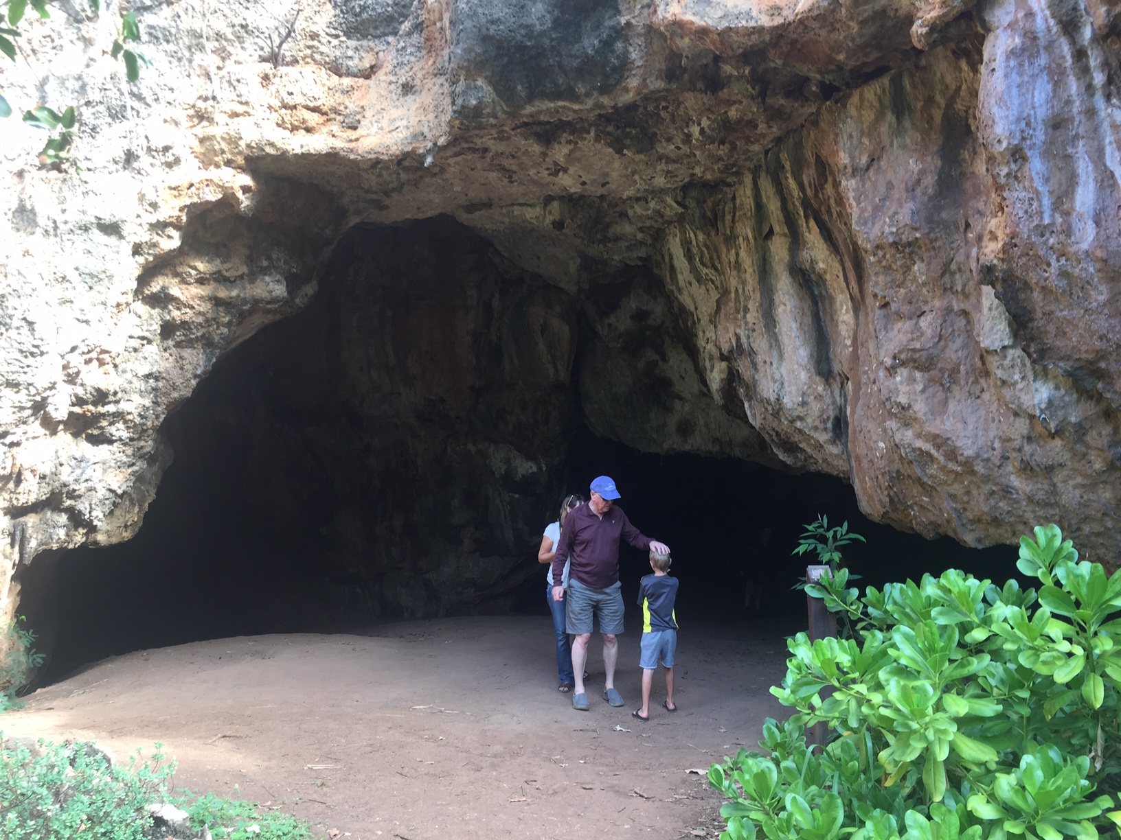 a family at the mouth of a cave