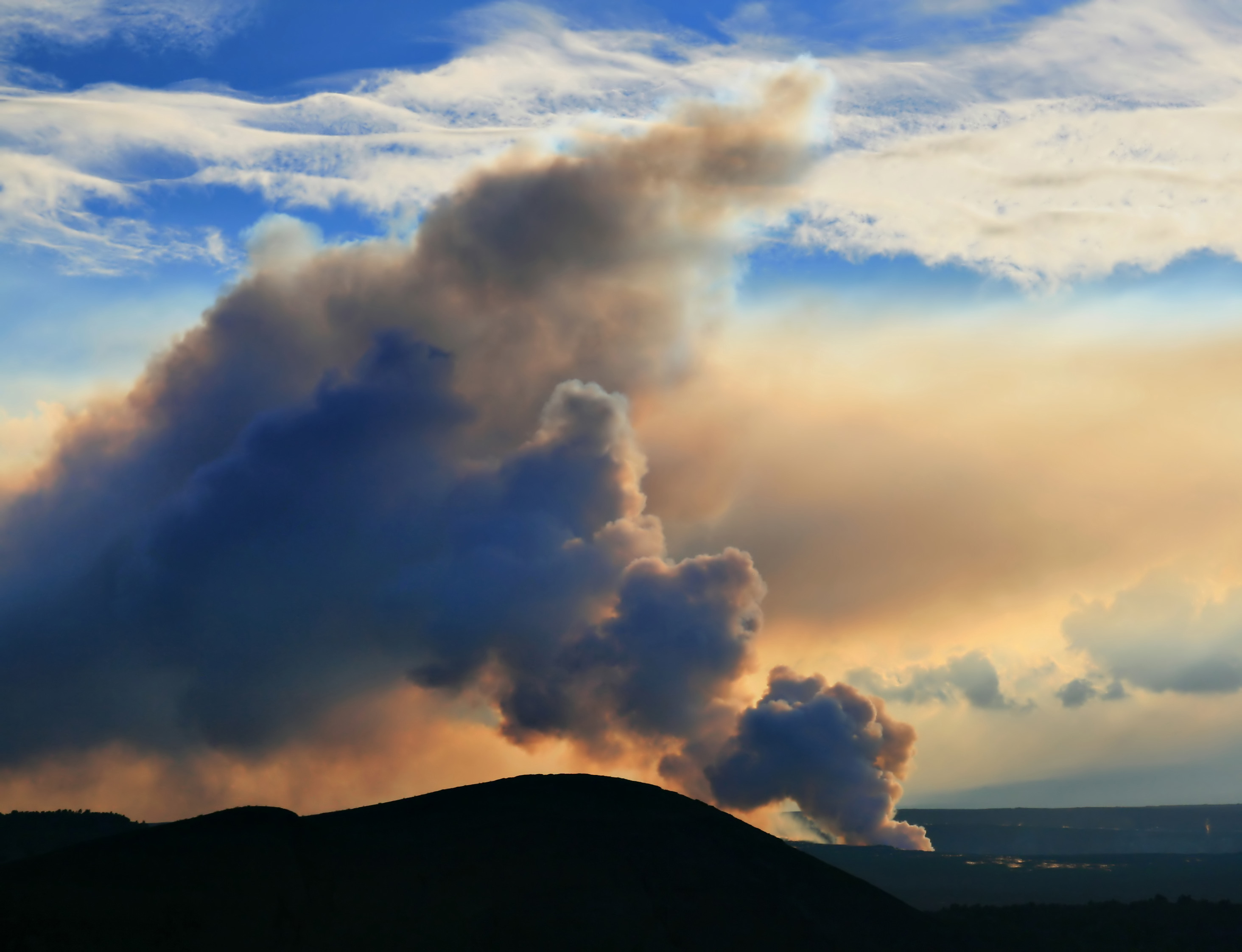 Vog coming off of lava pouring into ocean