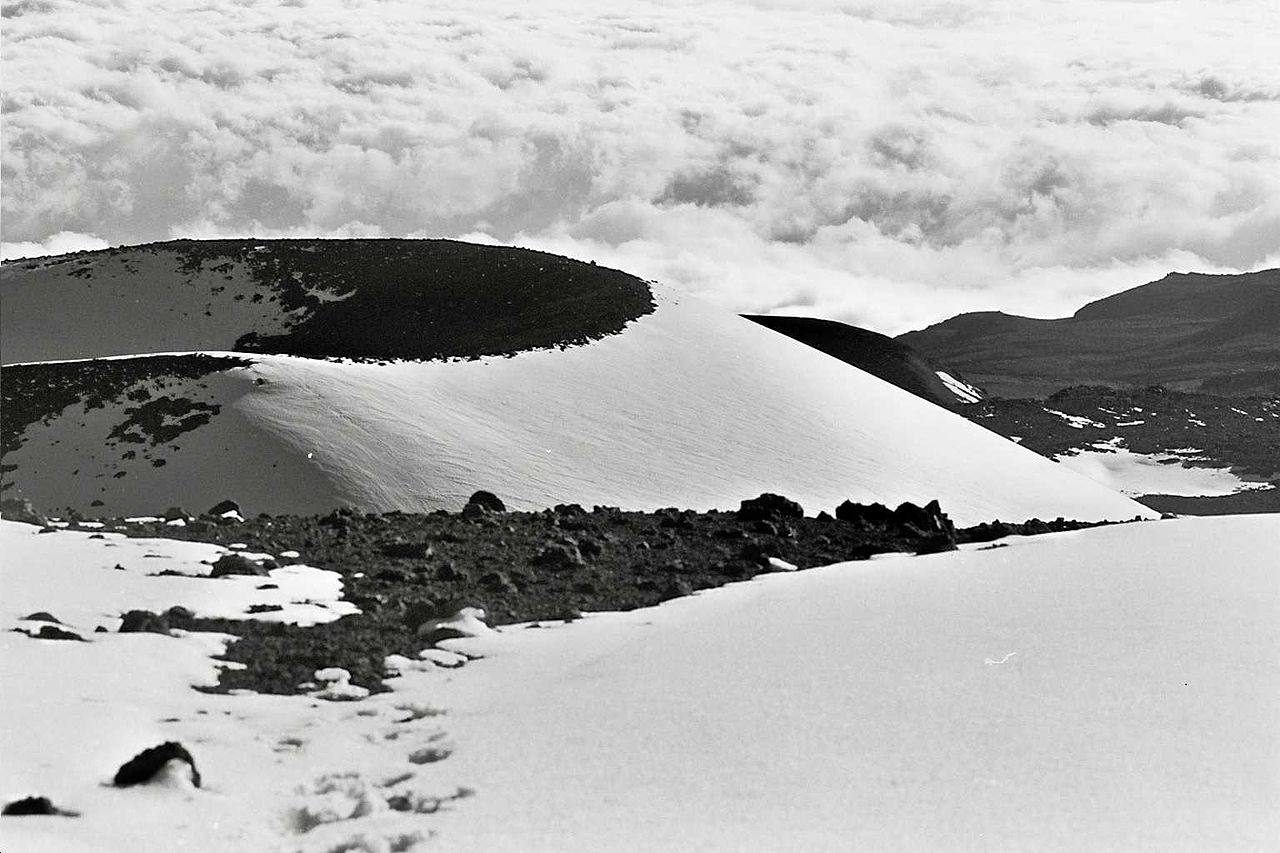 Snow capped cinder cones on top Mauna Kea