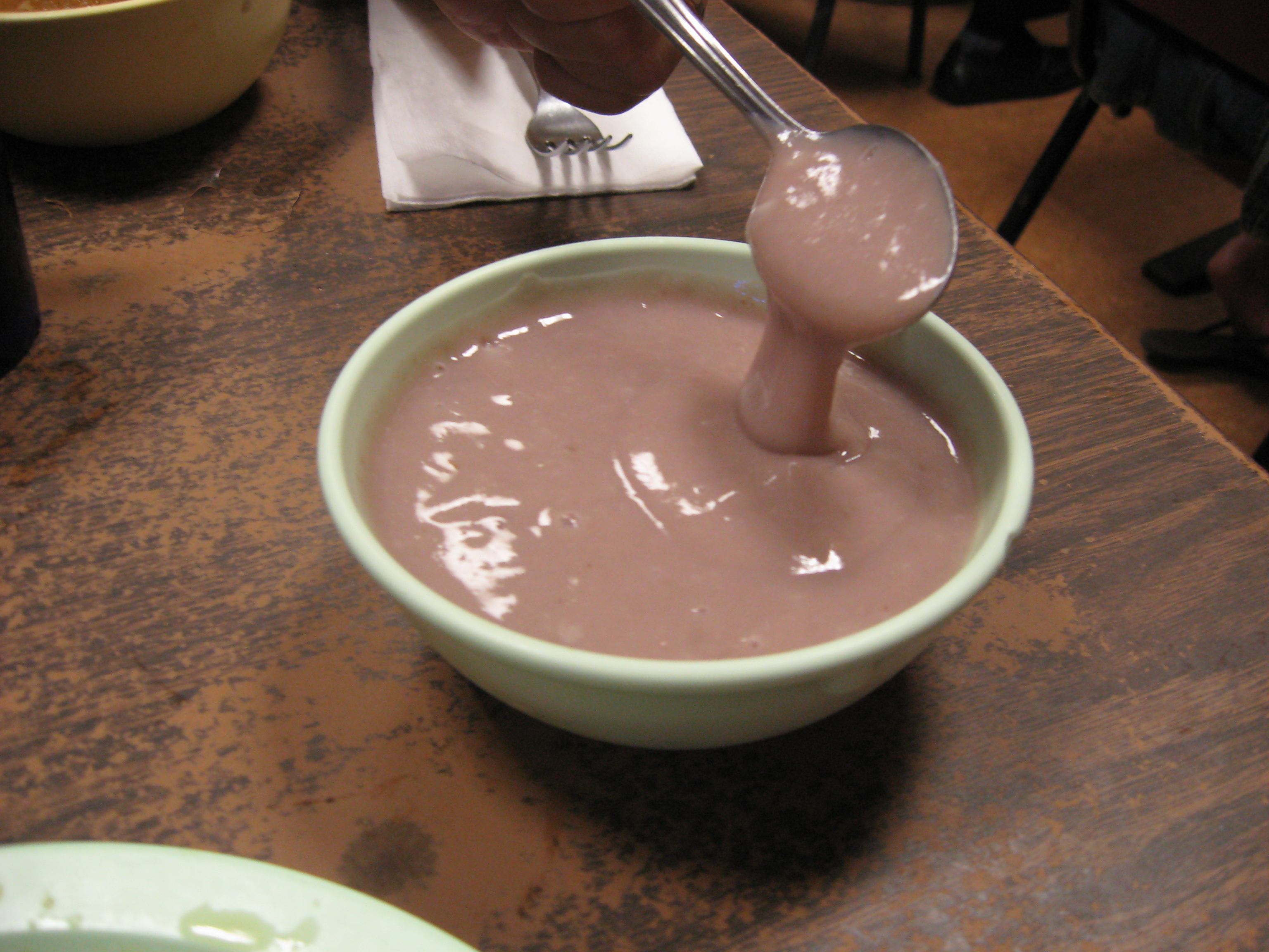 Spoon in bowl of poi