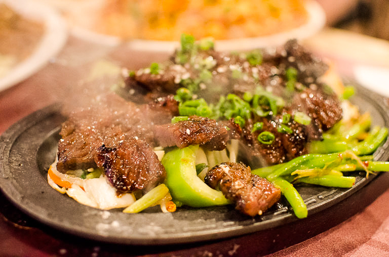 Char-broiled Korean-style short ribs served on a bed of stir-fried Asian greens and Kim Chee is one of my favorite dishes at Side Street Inn. Come here for local style comfort food, served family style. It will be one of the best meals of your trip!