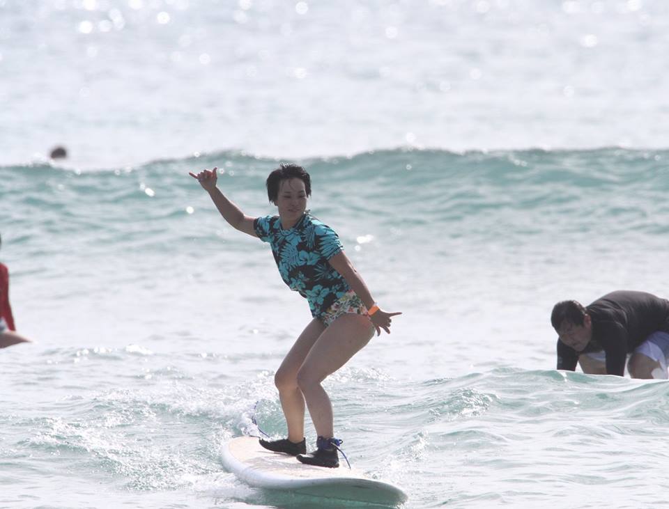 Woman surfing in Hawaii