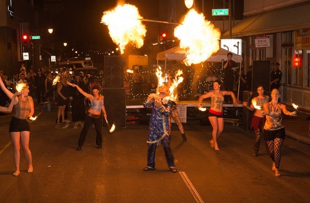 5 Fire dancers in a Hawaii Festivals parade